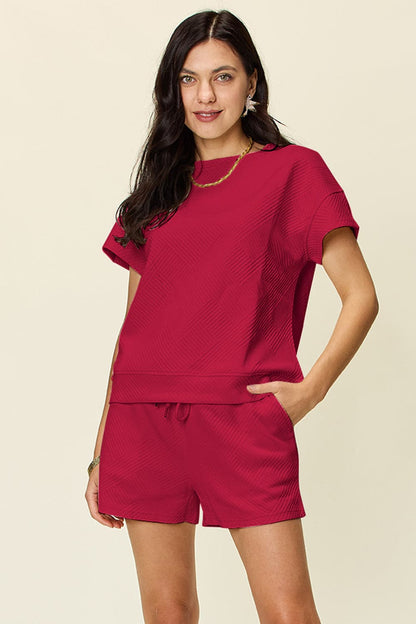 Double Take Full Size Texture Short Sleeve T-Shirt and Drawstring ShorFeatures: Drawstring
Number of pieces: Two-piece
Stretch: Slightly stretchy
Material composition: 97% polyester, 3% spandex
Care instructions: Machine wash cold. TumLove Salve Full Size Texture Short SleeveTwo-Piece Sets