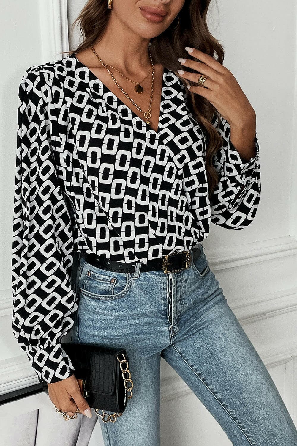 Geometric V-Neck Long Sleeve BlouseUpgrade Your Wardrobe with Style: Geometric V-Neck Long Sleeve Blouse
 Indulge in elegance and sophistication with our Geometric V-Neck Long Sleeve Blouse. Elevate yLove Salve -Neck Long Sleeve BlouseBlouses