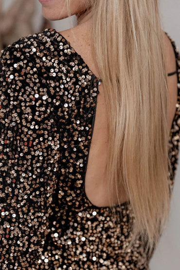 Backless sequin party dress with long sleeves and sparkle detail.