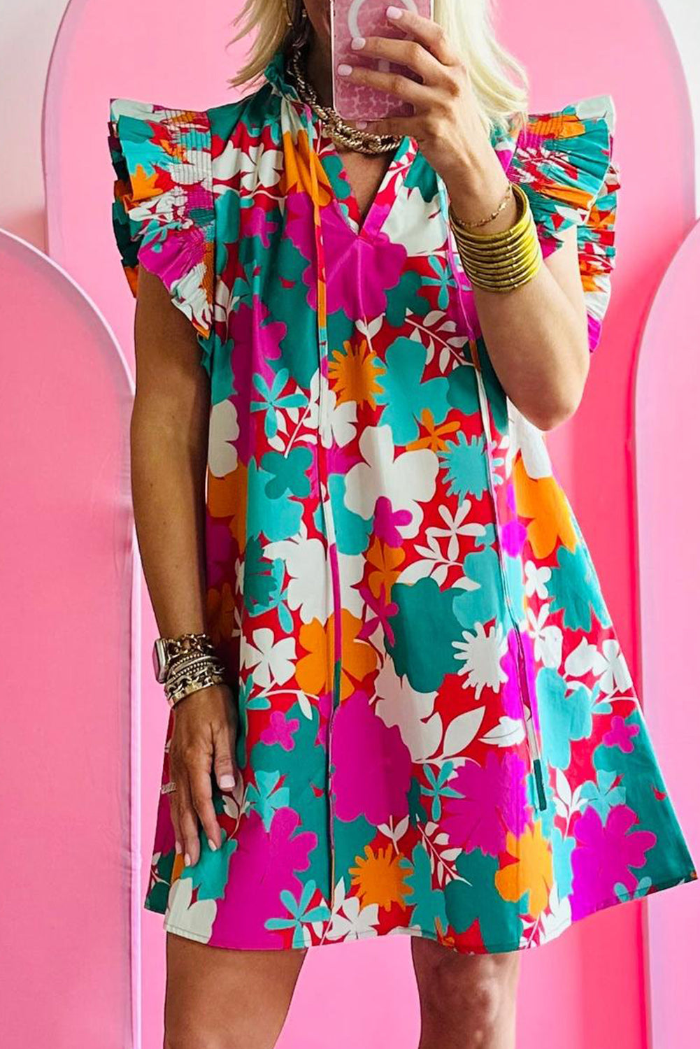 Vibrant floral tie neck mini dress with flutter sleeves