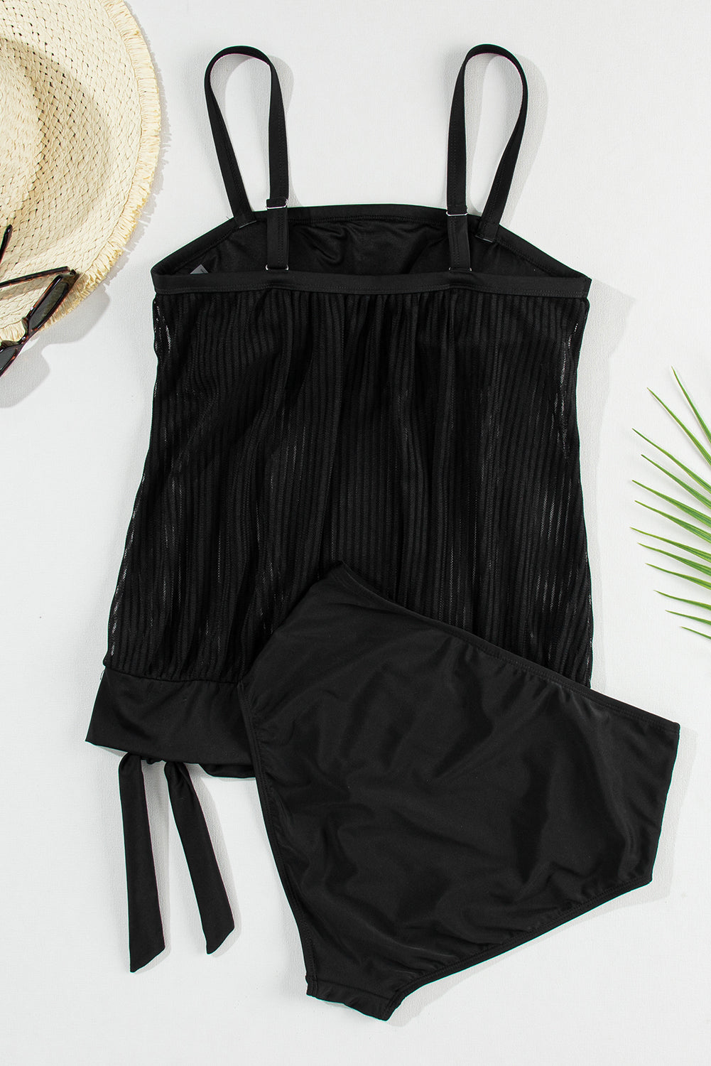 Striking black striped tankini with a chic knotted hem