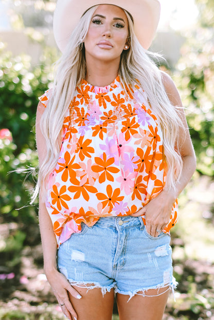 Floral delight: Orange ruffled sleeve top with smocked detail