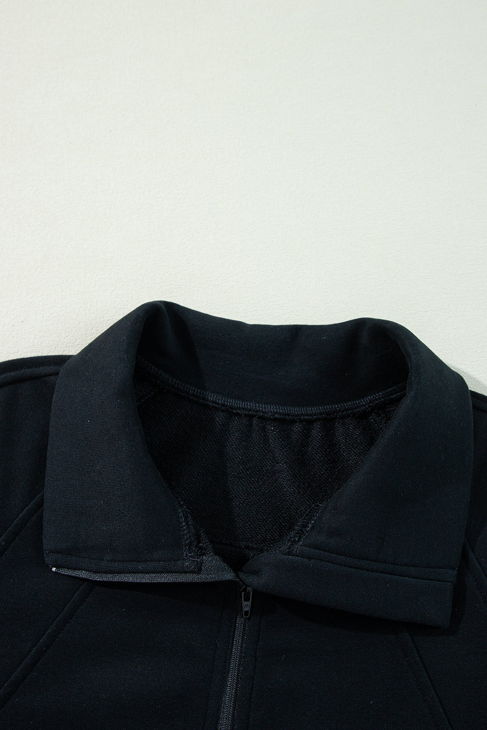 Chic black quarter zip sweatshirt with kangaroo pocket