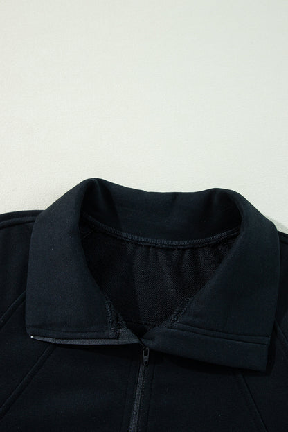 Chic black quarter zip sweatshirt with kangaroo pocket