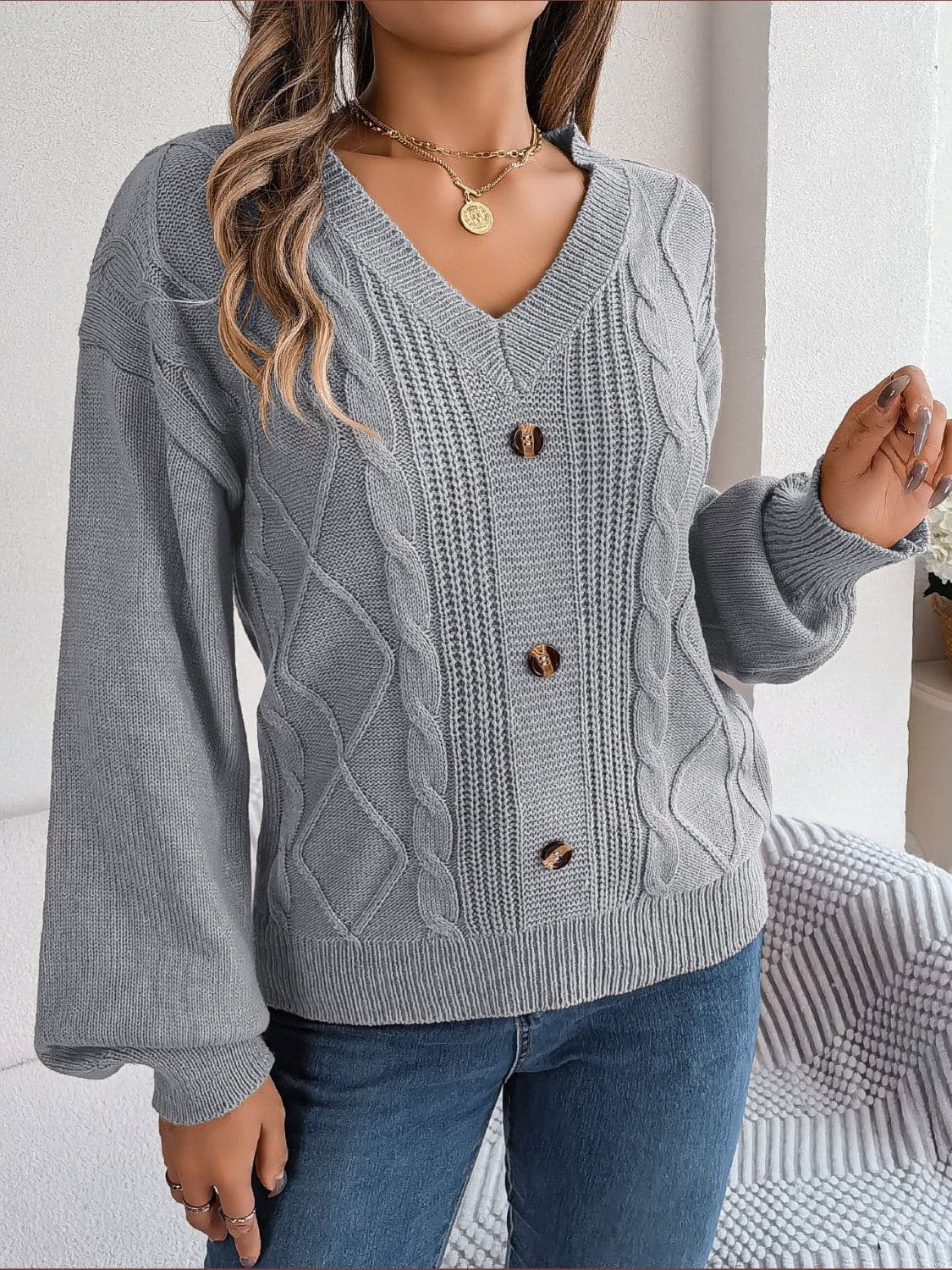 Cable-Knit Buttoned V-Neck Sweater.