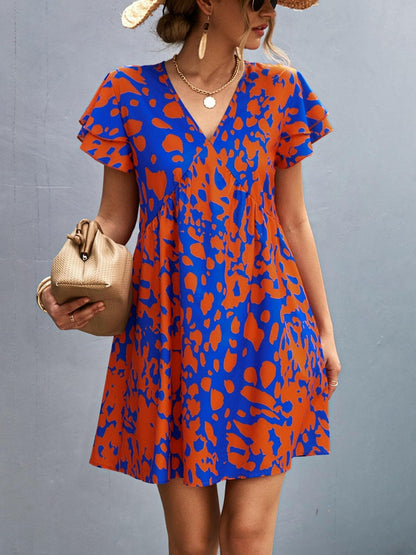 Ruffled Printed V-Neck Short Sleeve Mini DressUpgrade Your Wardrobe with our Ruffled Printed V-Neck Short Sleeve Mini Dress
 Step out in style with our stunning Ruffled Printed V-Neck Short Sleeve Mini Dress. ElLove Salve -Neck Short Sleeve Mini Dress