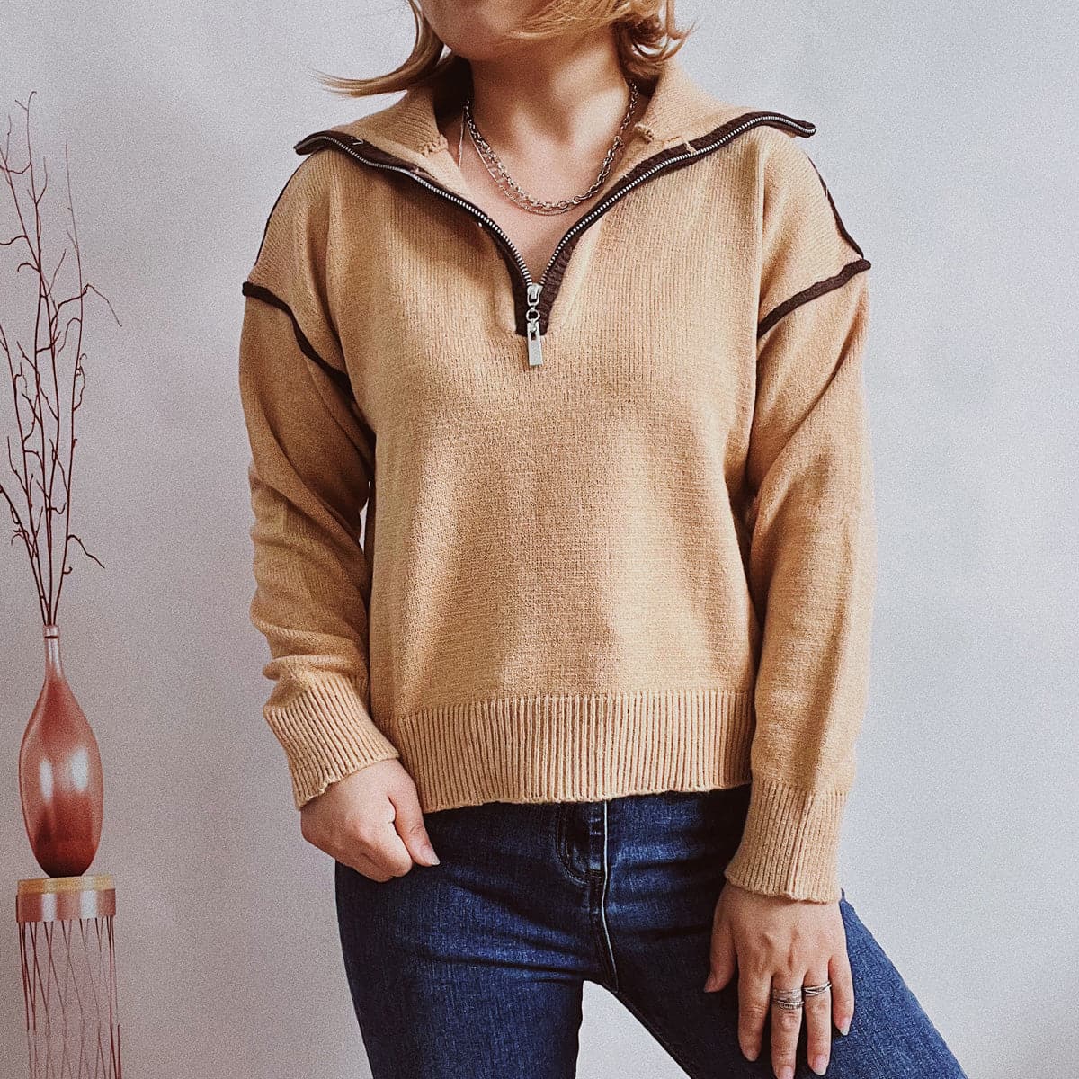 Exposed Seam Half Zip Sweater.