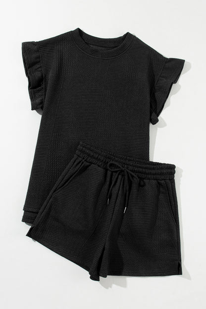 Chic black ruffled top and drawstring shorts set