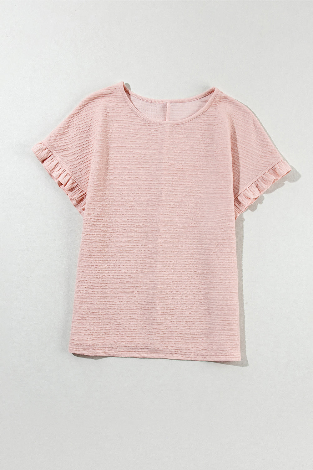 Chic light pink ruffled short sleeve blouse with textured elegance