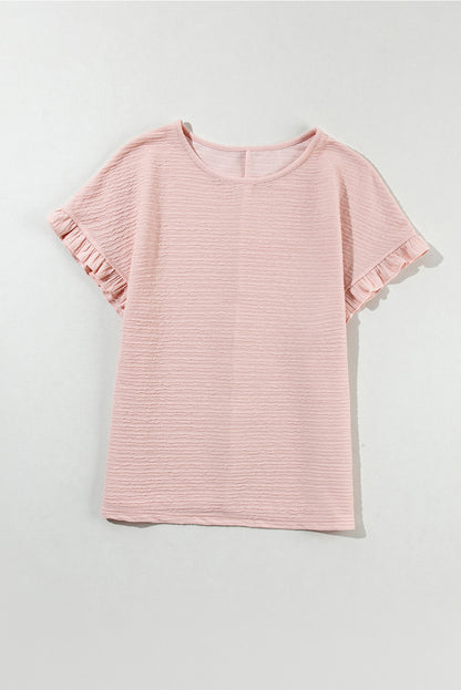 Chic light pink ruffled short sleeve blouse with textured elegance