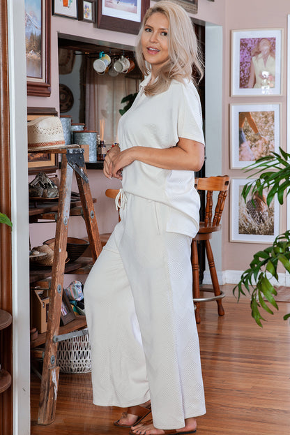 Chic beige plus size textured top and pants ensemble