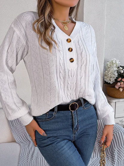 Chic cable-knit v-neck sweater with buttoned details