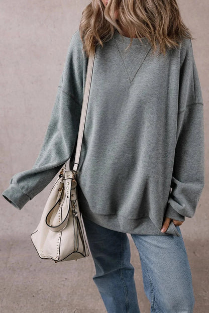 Slit Round Neck Long Sleeve Sweatshirt.