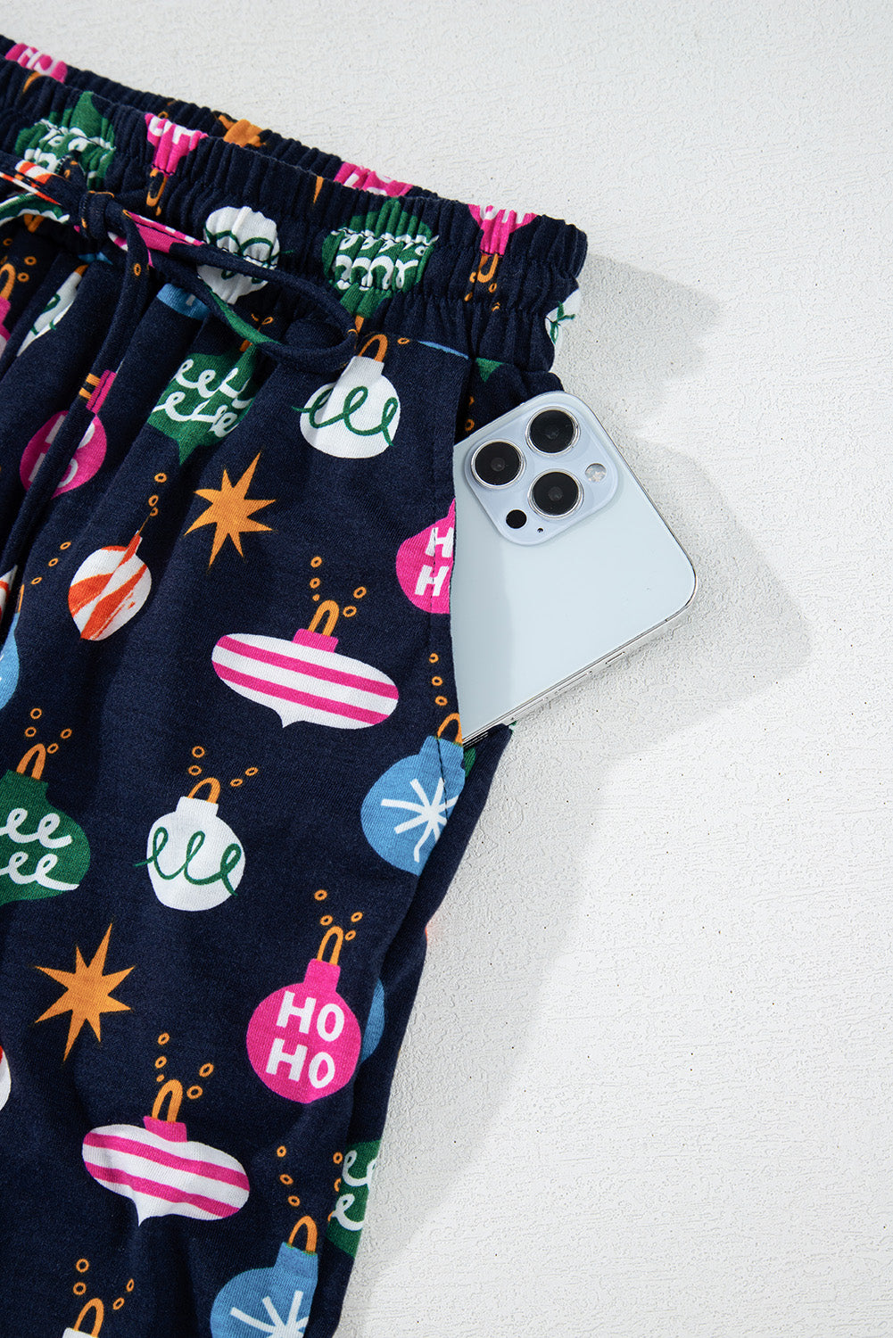 Navy blue festive Christmas lights pajama set with shirt and pants