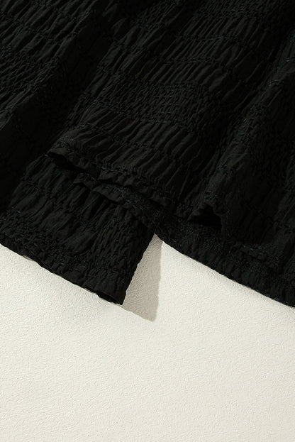 Relaxed black textured smocked waist wide-leg pants