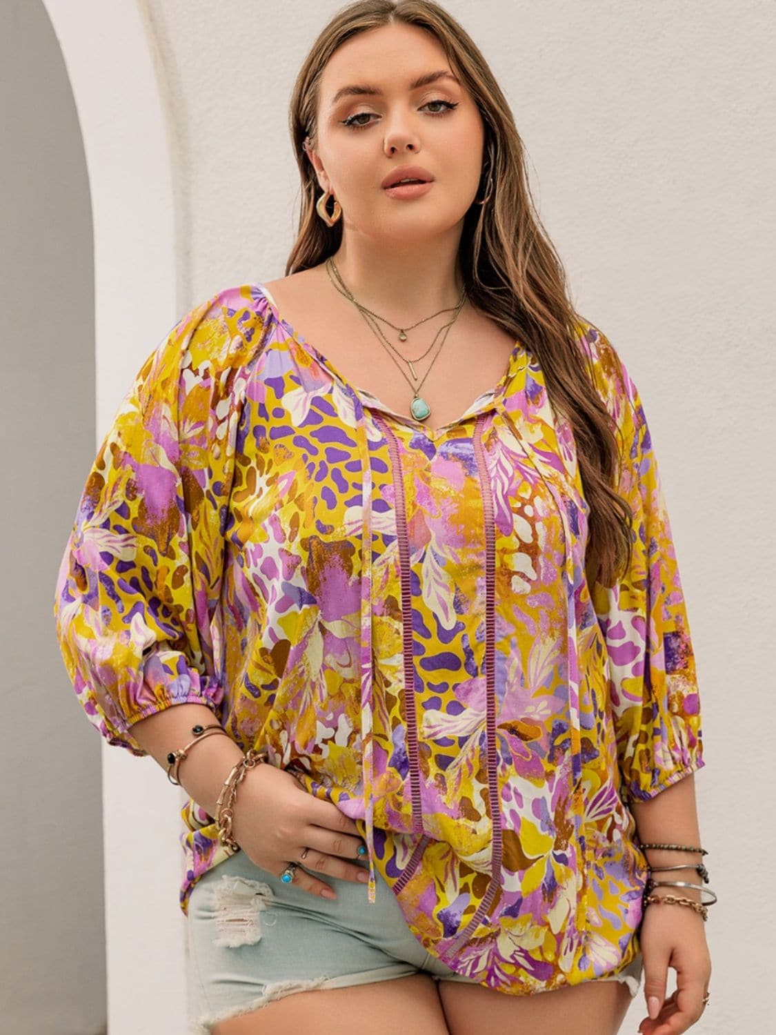 Plus Size Printed Tie Neck Blouse.