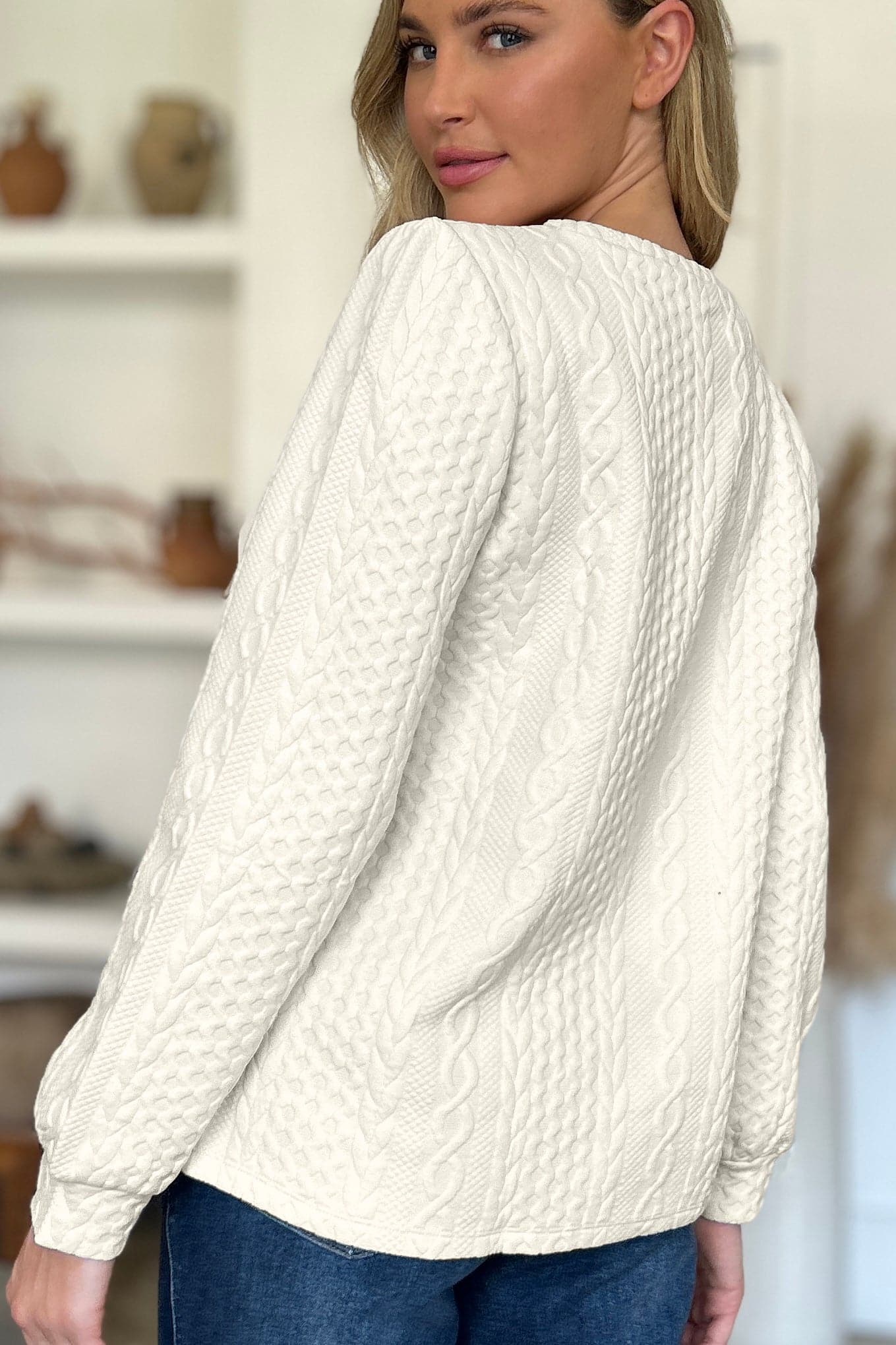 Textured Round Neck Long Sleeve Sweatshirt.