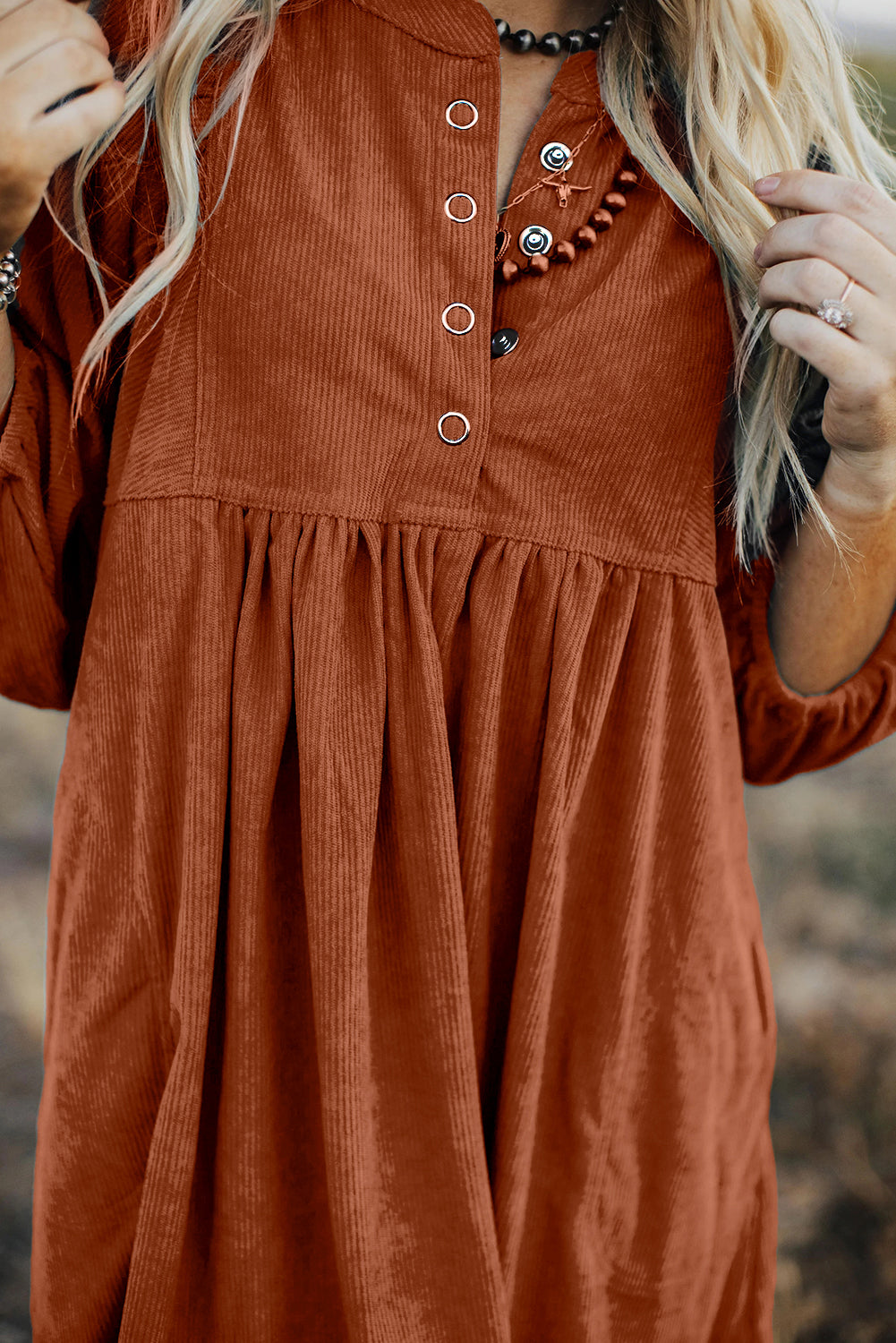 Chic gold flame corduroy dress with snap buttons and bracelet sleeves