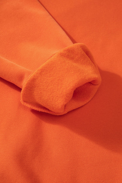 Cozy russet orange fleece-lined sweatshirt with drop shoulders