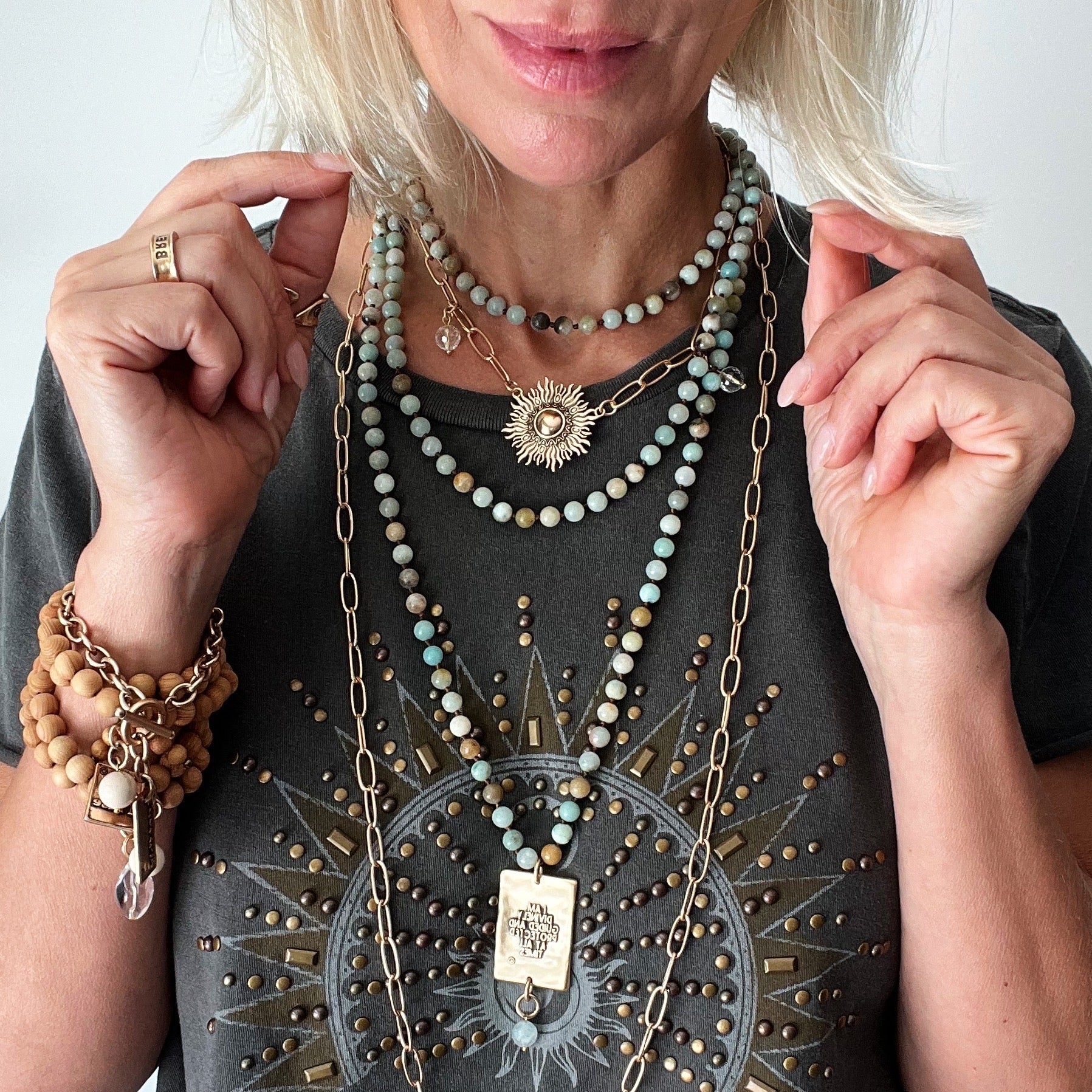 Katia Designs Perfectly Imperfect Starburst Long Chain Necklace displayed in a stylish flat lay arrangement.