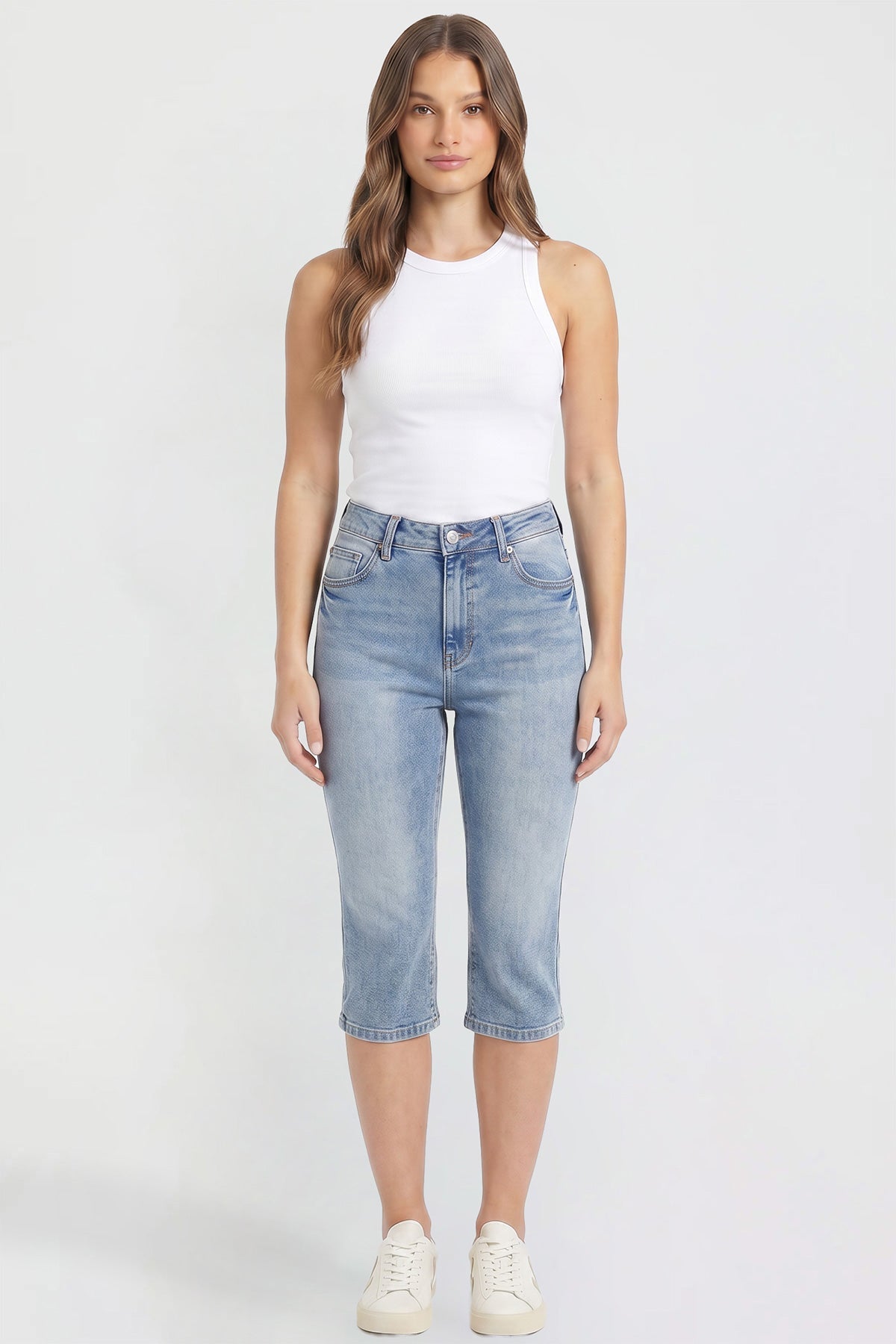 YMI JEANS Luxe High Rise Capri showing the detailed side slit on the cropped pant leg.
