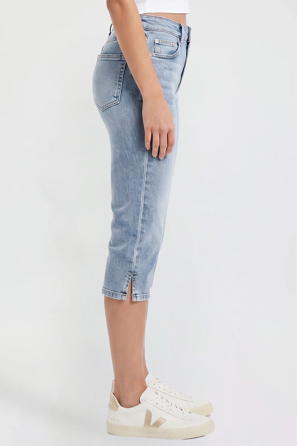 Model wearing YMI JEANS stretch capri pants, a perfect casual style for comfortable summer wear.