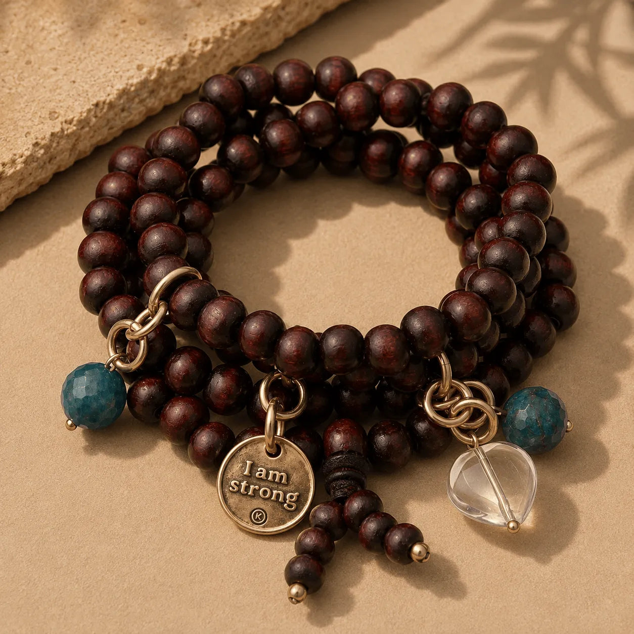 Katia Designs I Am Strong Heart Wood Boho Wrap Bracelet/Necklace, featuring natural wood beads and an inspiring heart charm.