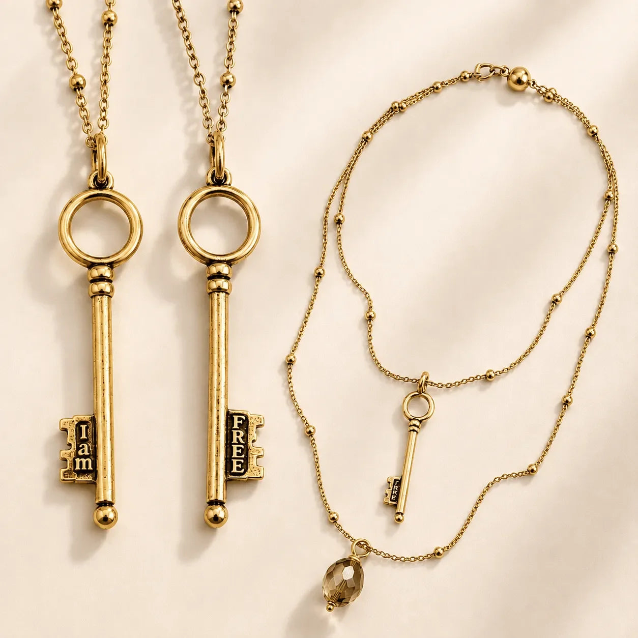 Katia Designs I Am Free Key Dainty Necklace, showcasing the intricate key pendant and shimmering gold satellite chain detail.