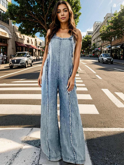 Wide leg denim overalls with adjustable straps for style and comfort.