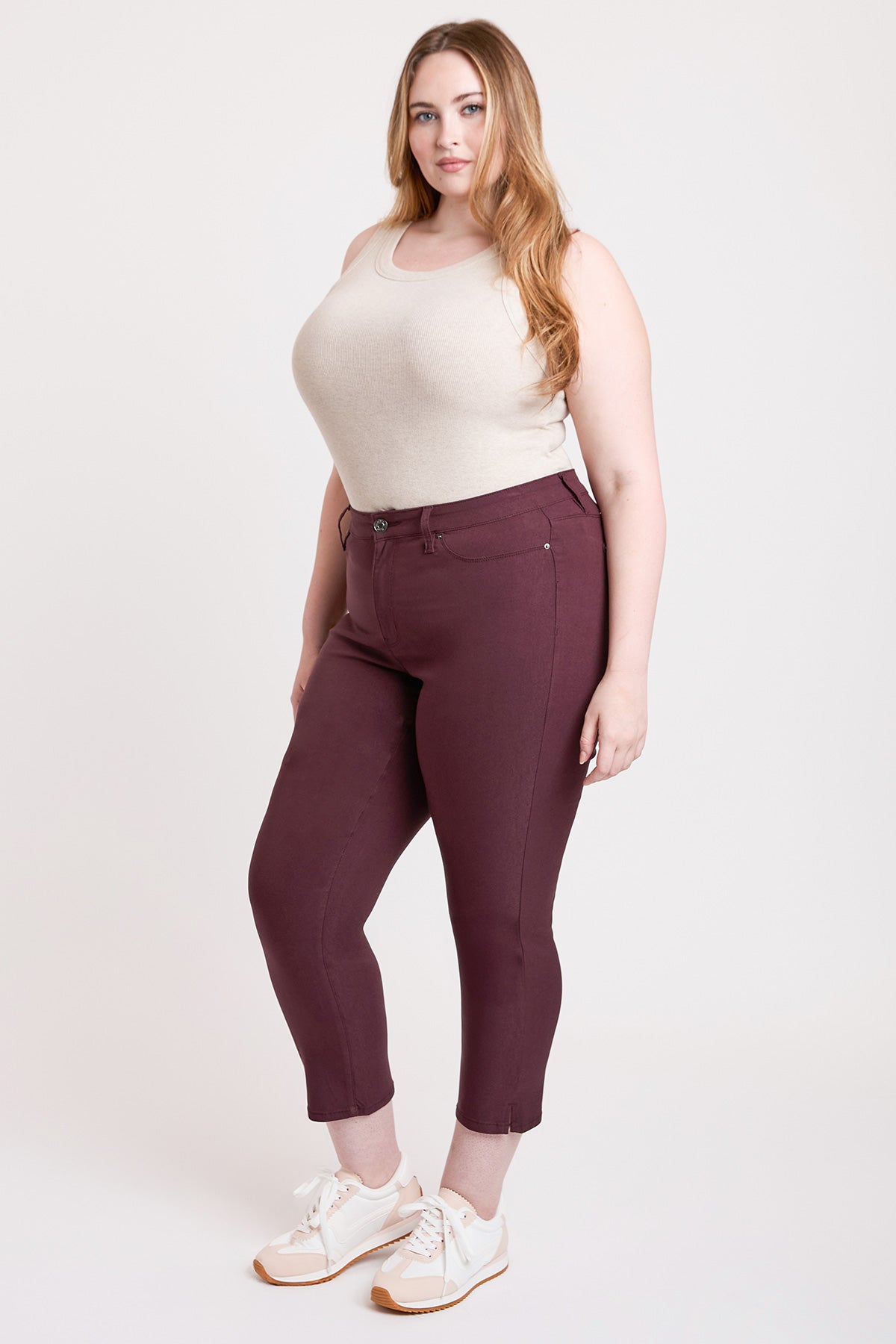 A pair of YMI JEANS Women's Plus High Rise Hyperstretch Cropped Straight Pants, laid flat, displaying their versatile design.