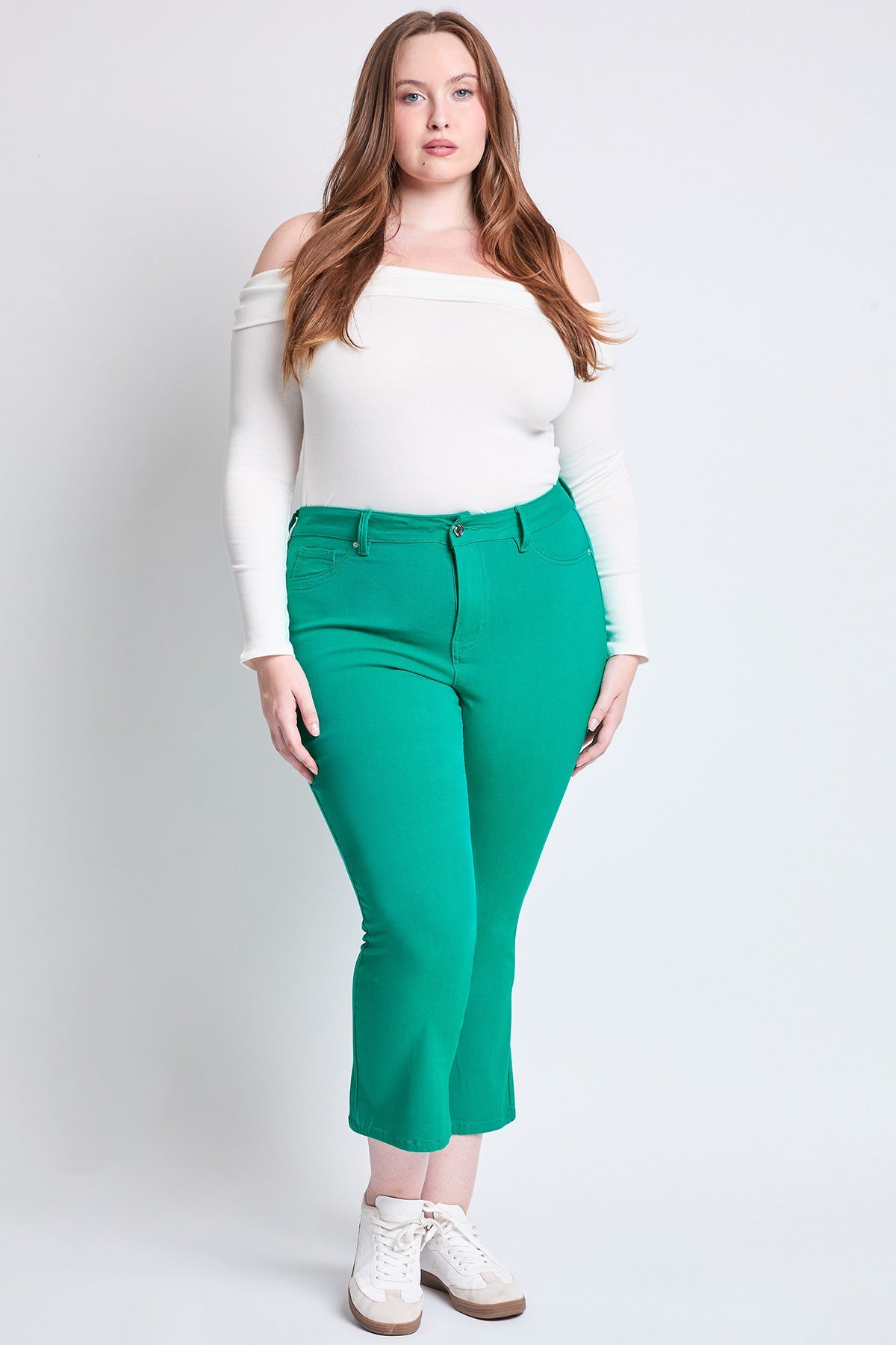 Back view of YMI JEANS Plus Size Hyperstretch Cropped Kick Flare Pants, showing pocket design.