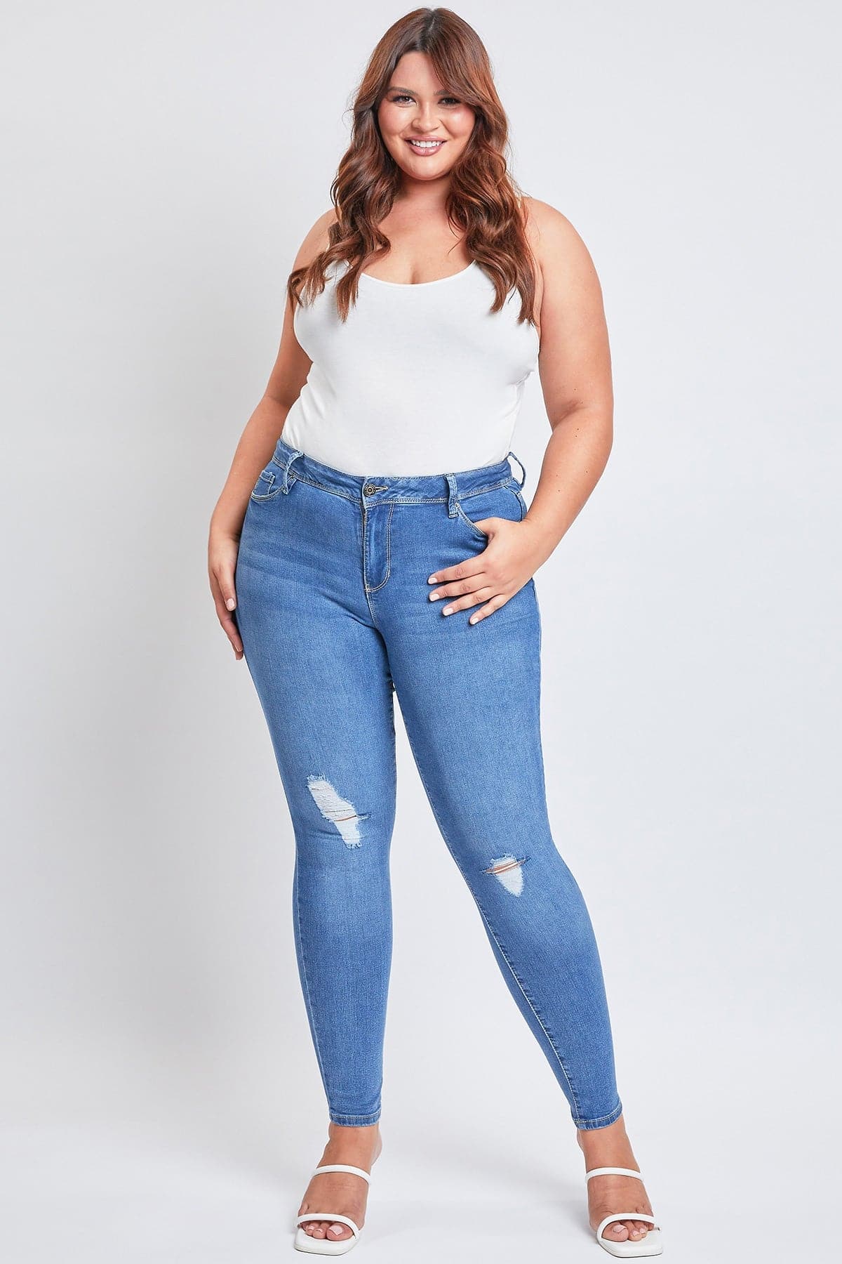 Close-up of the distressed knee detail on YMI JEANS Women's Plus Essential Sustainable Skinny Jeans.