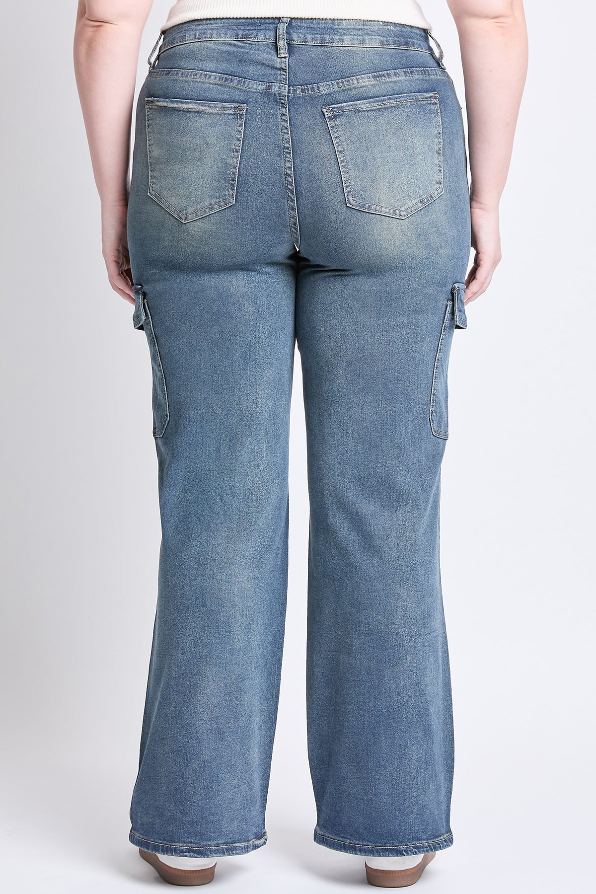 Close-up of YMI JEANS Plus High Rise Wide Leg Skater Cargo Jeans pocket detail, durable blue denim fabric.