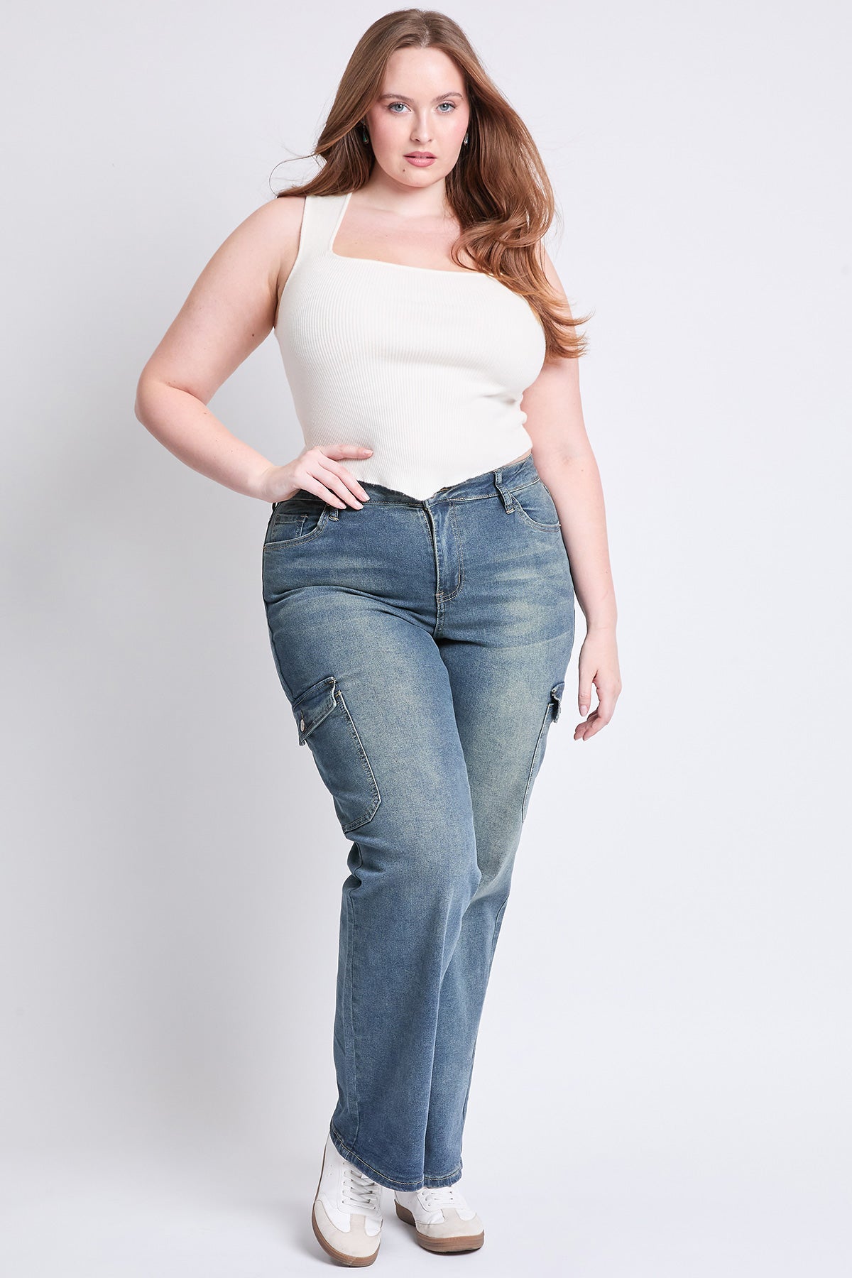Detail shot of the wide leg hem on YMI JEANS Women's Plus High Rise Skater Cargo Jeans, quality denim.