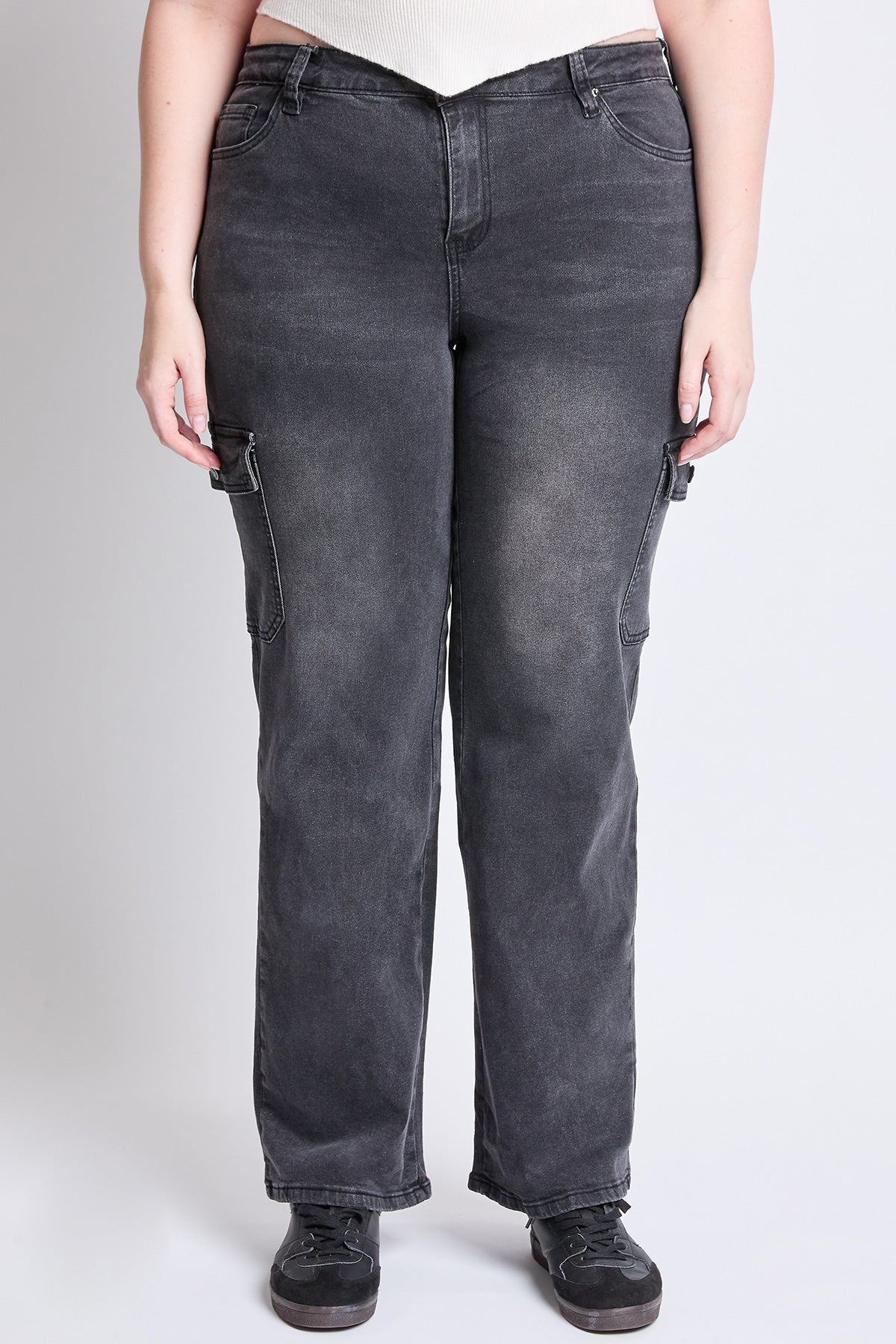 Model wearing YMI JEANS Plus Skater Cargo Jeans, showcasing the stylish wide leg and comfortable high rise.