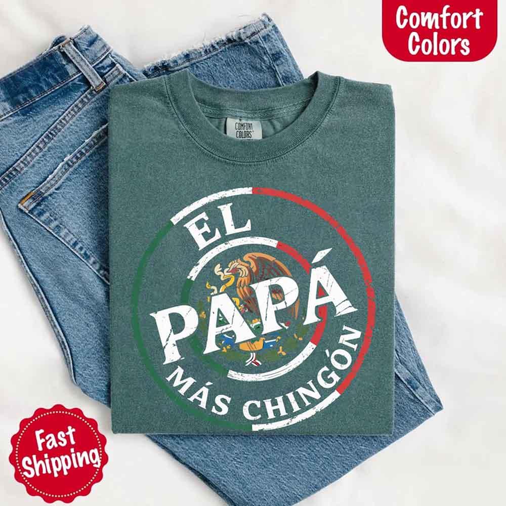 A happy man wearing the Adorb Custom Tees El Papá Más Chingón shirt, a great Father's Day gift for a Mexican dad.