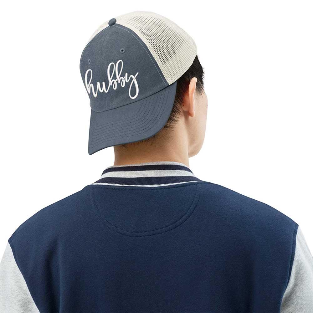 Adorb.co Hubby Pigment-Dyed Trucker Hat worn by a person, showcasing its casual style and quality headwear for a thoughtful g