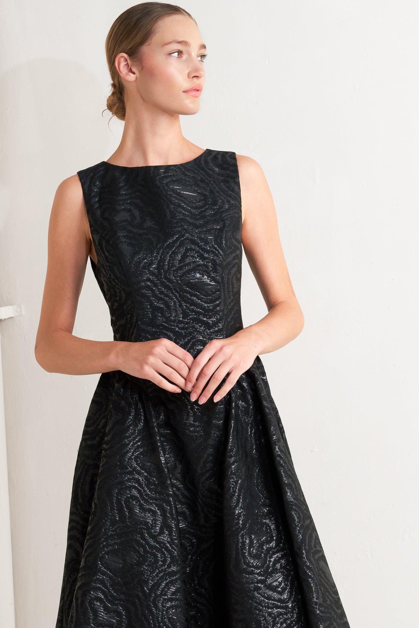 Model showcasing the Flying Tomato CHECK YOURSELF black woven midi dress, highlighting its flattering silhouette.