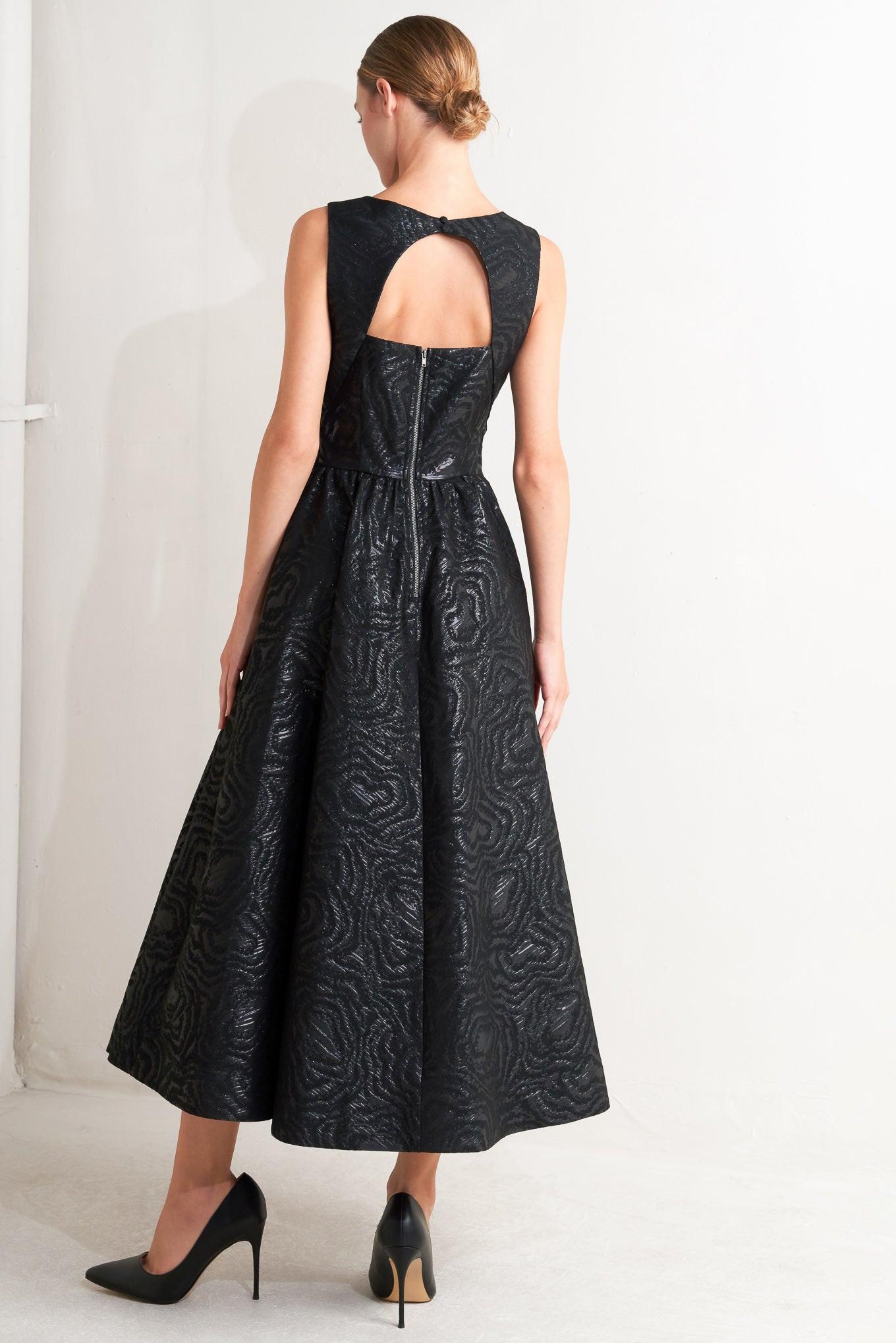 Refined hemline detail of the Flying Tomato CHECK YOURSELF black woven midi dress, showcasing its sophisticated finish.