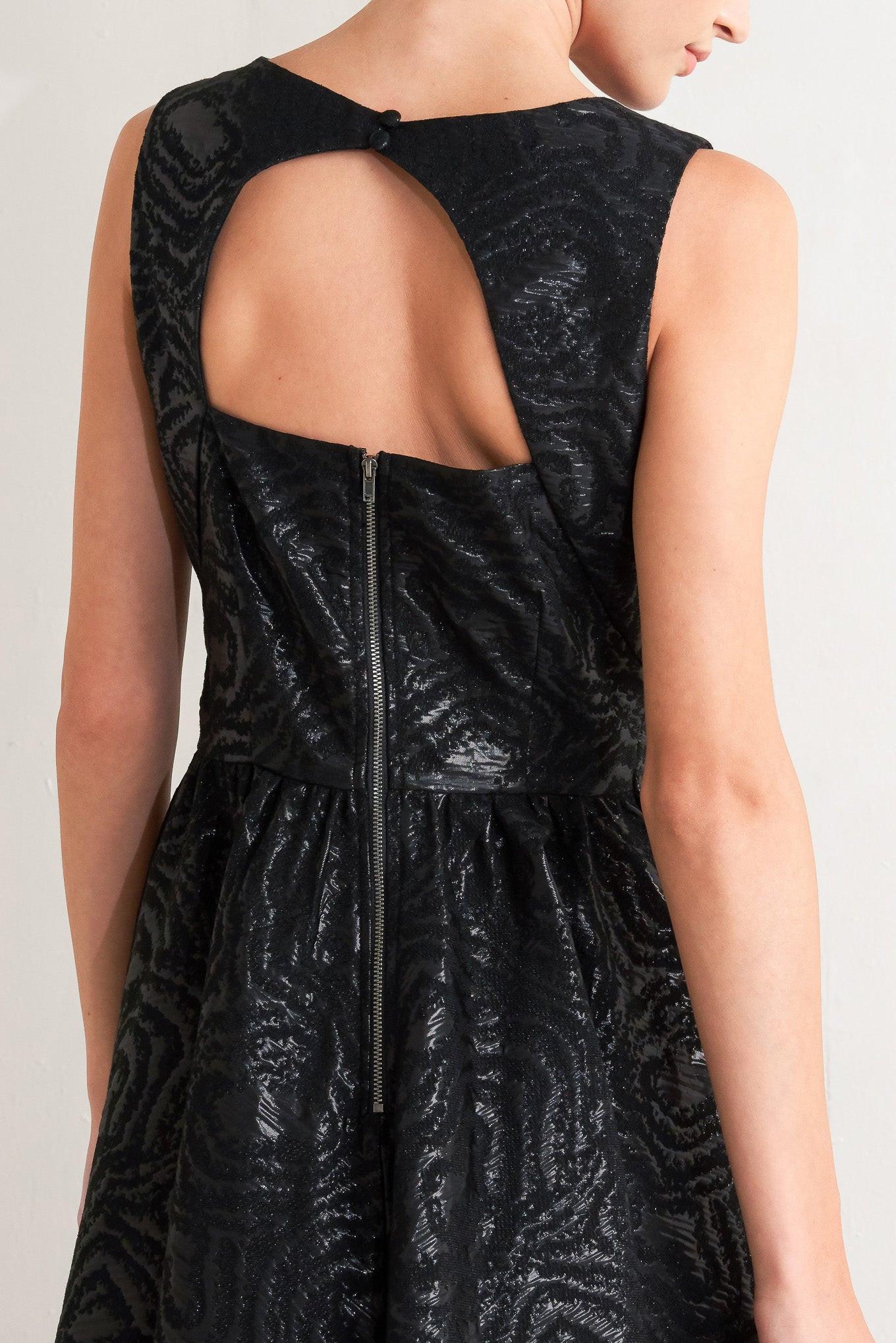 Close-up of the Flying Tomato CHECK YOURSELF black woven midi dress fabric, revealing its intricate texture and quality.