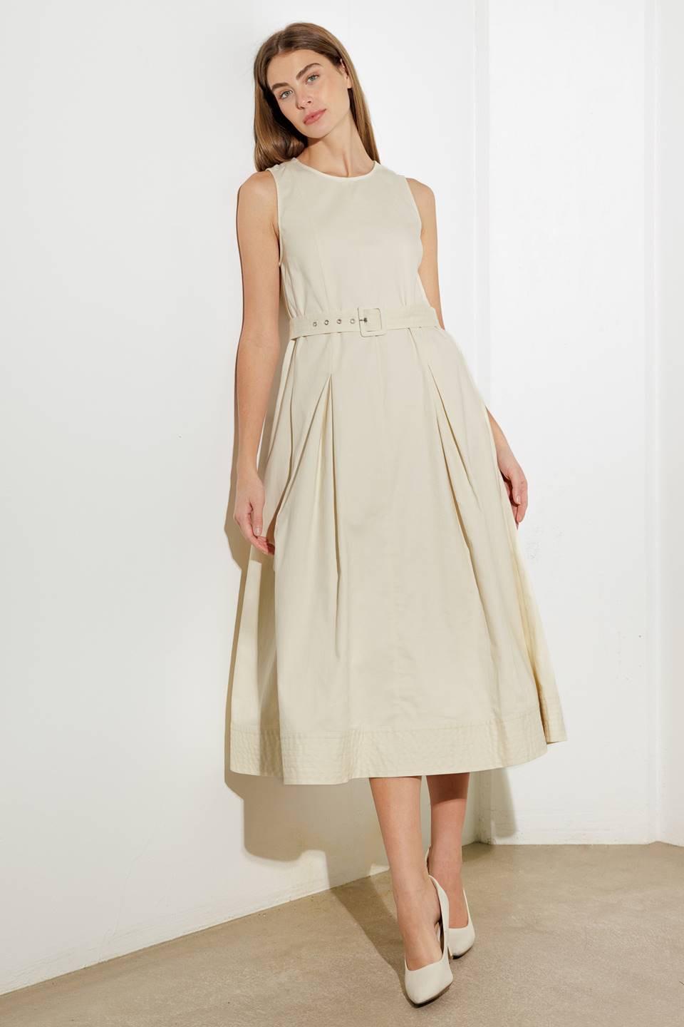 Model wearing the Flying Tomato OVER THE WATERS WOVEN MIDI DRESS, styled for a relaxed yet sophisticated outdoor occasion.