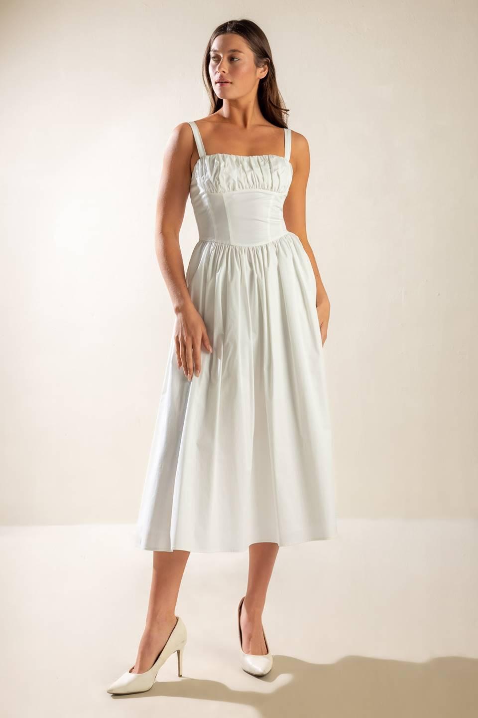 Hemline detail of the Flying Tomato Easily Loved Woven Midi Dress, showcasing its perfect midi length and refined finish.