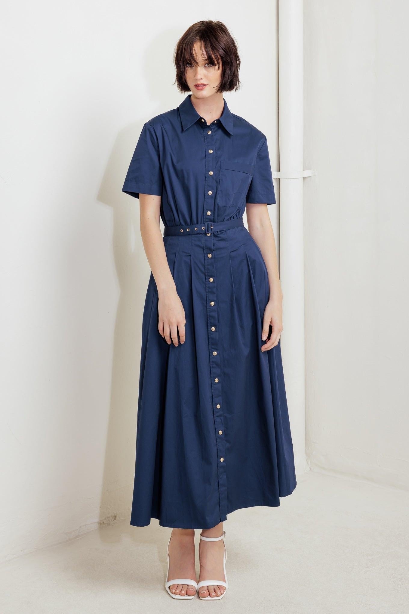 Close-up detail of the woven fabric and cinched waist design on the Flying Tomato Midi Dress.
