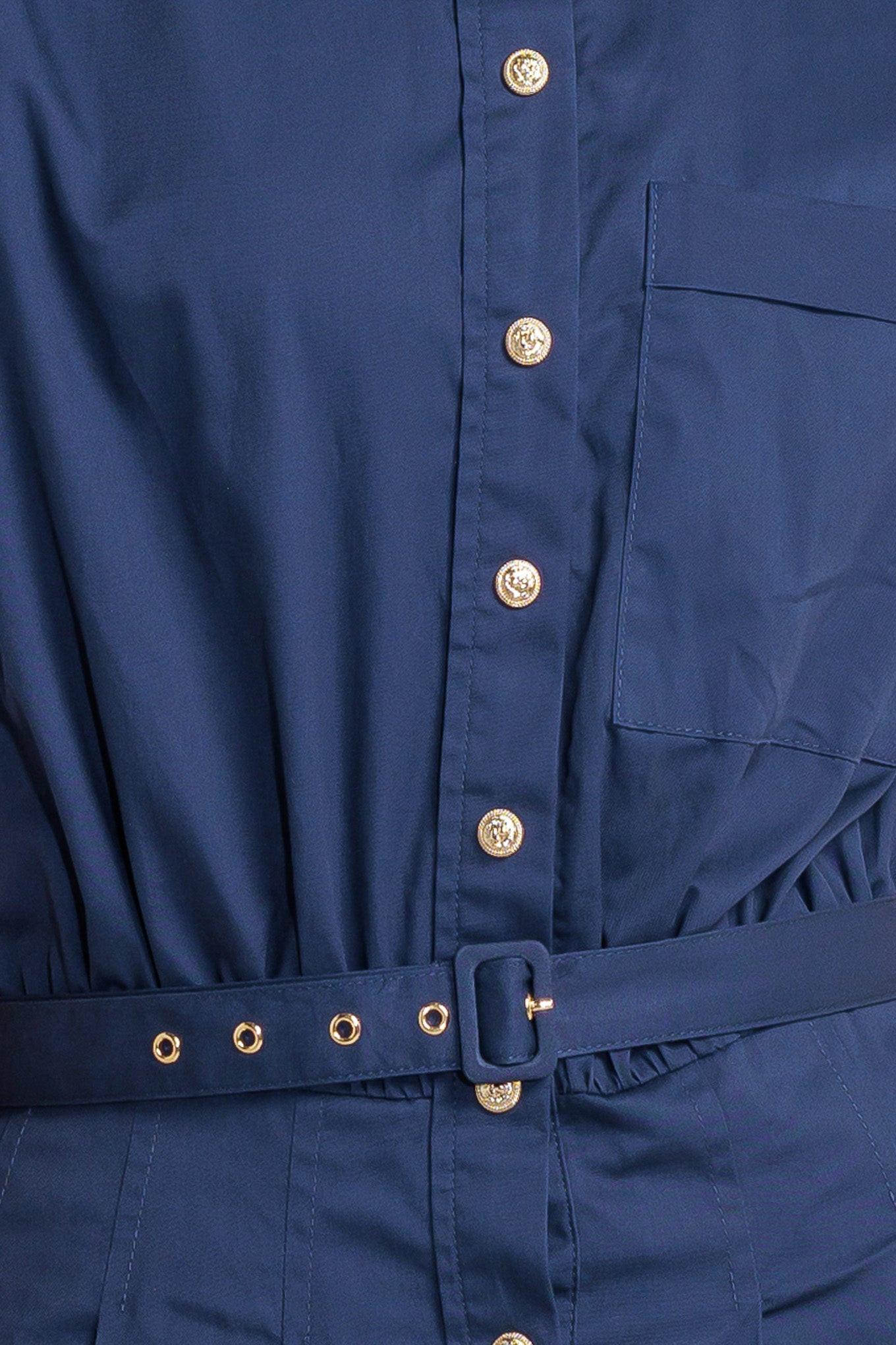 Hemline and lower detail of the Flying Tomato Cinched Couture Woven Midi Dress, highlighting its quality finish.