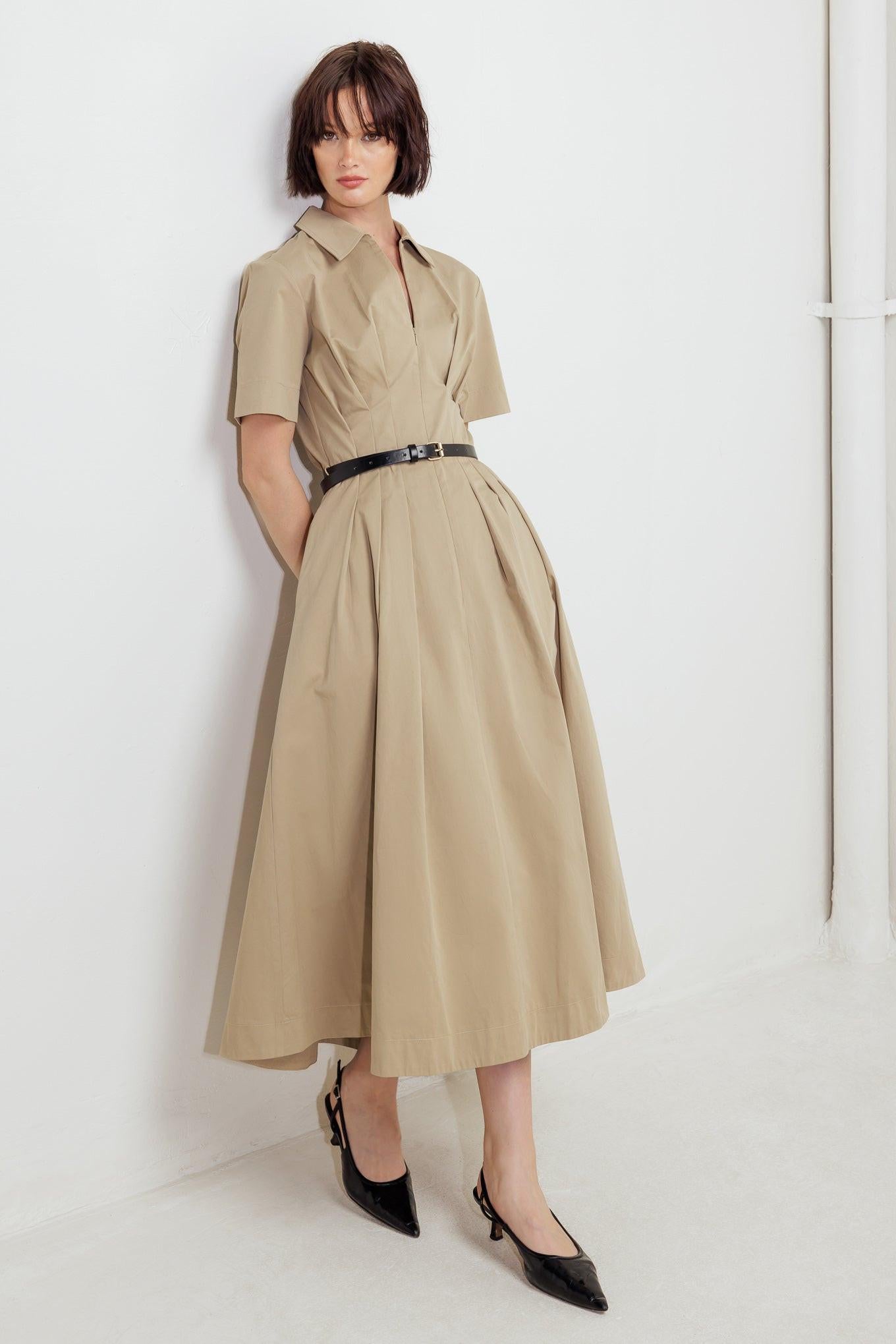 Ultra close-up of the Flying Tomato Quiet Romance Tan Woven Midi Dress woven fabric, highlighting its natural texture and soft, breathable feel.