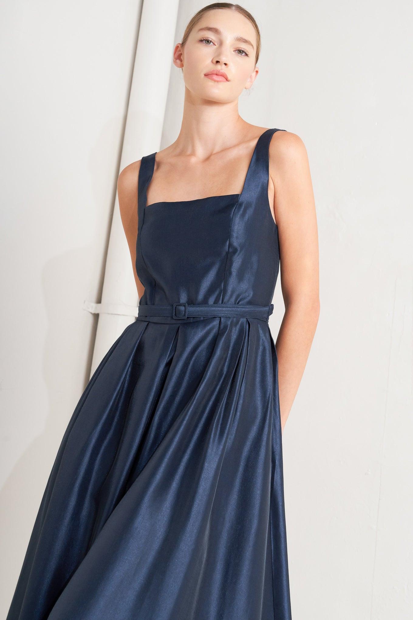 Close-up of the Flying Tomato Femme Silhouette Woven Midi Dress, highlighting the intricate woven fabric and elegant neckline.