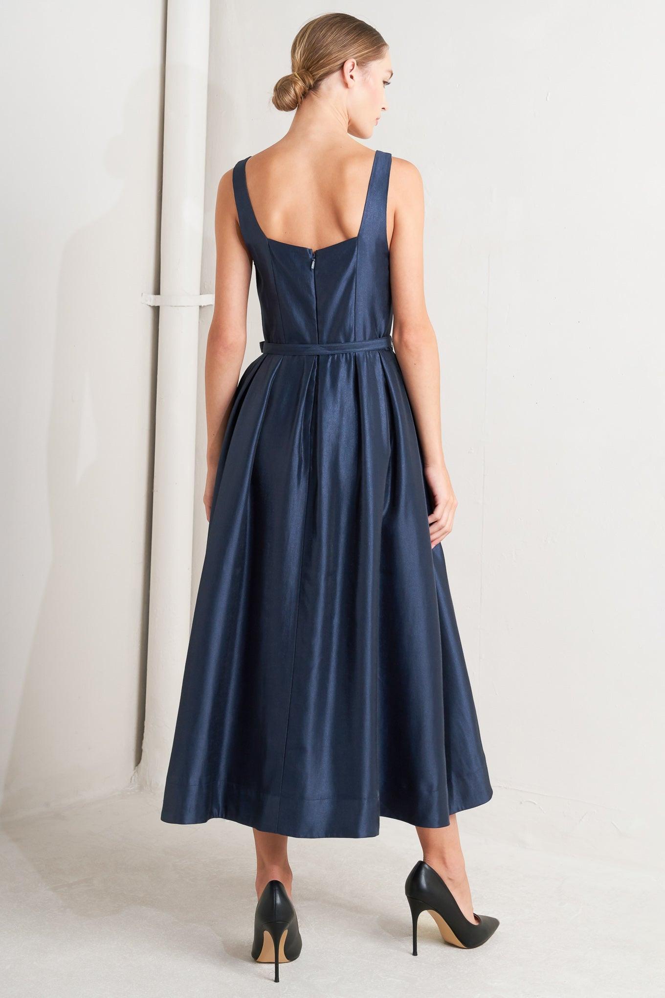 Back view of the Flying Tomato Femme Silhouette Woven Midi Dress, emphasizing its elegant design and flattering silhouette.