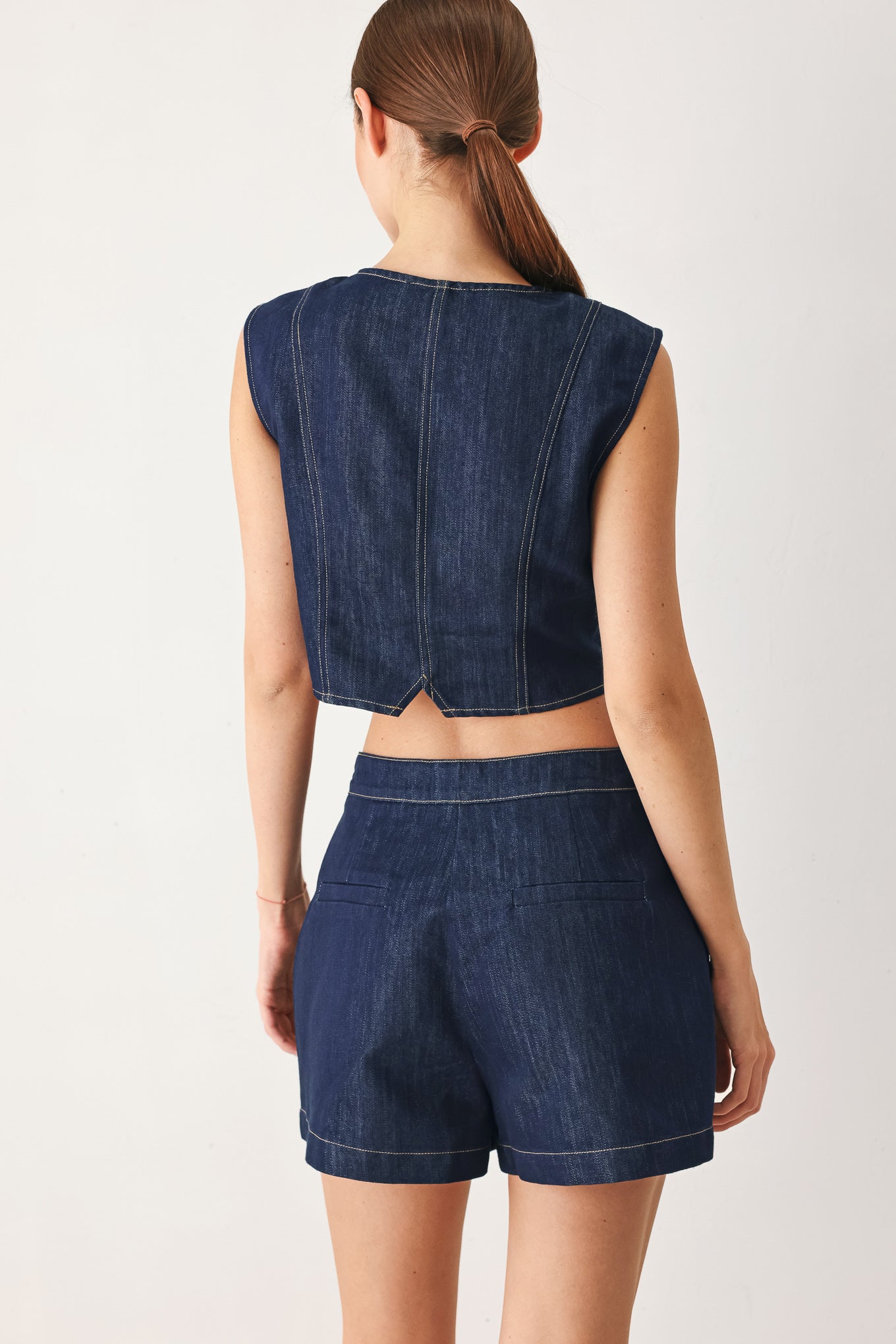 Indigo Denim Crop Vest With Front Button Closure And Chest Pockets
