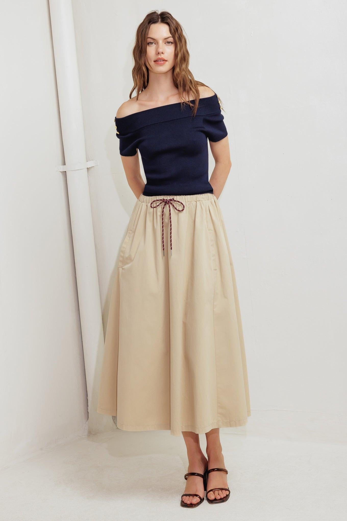 Flying Tomato Weekend Parisian Woven Midi Skirt, highlighting its elegant flow and quality woven fabric for effortless style.