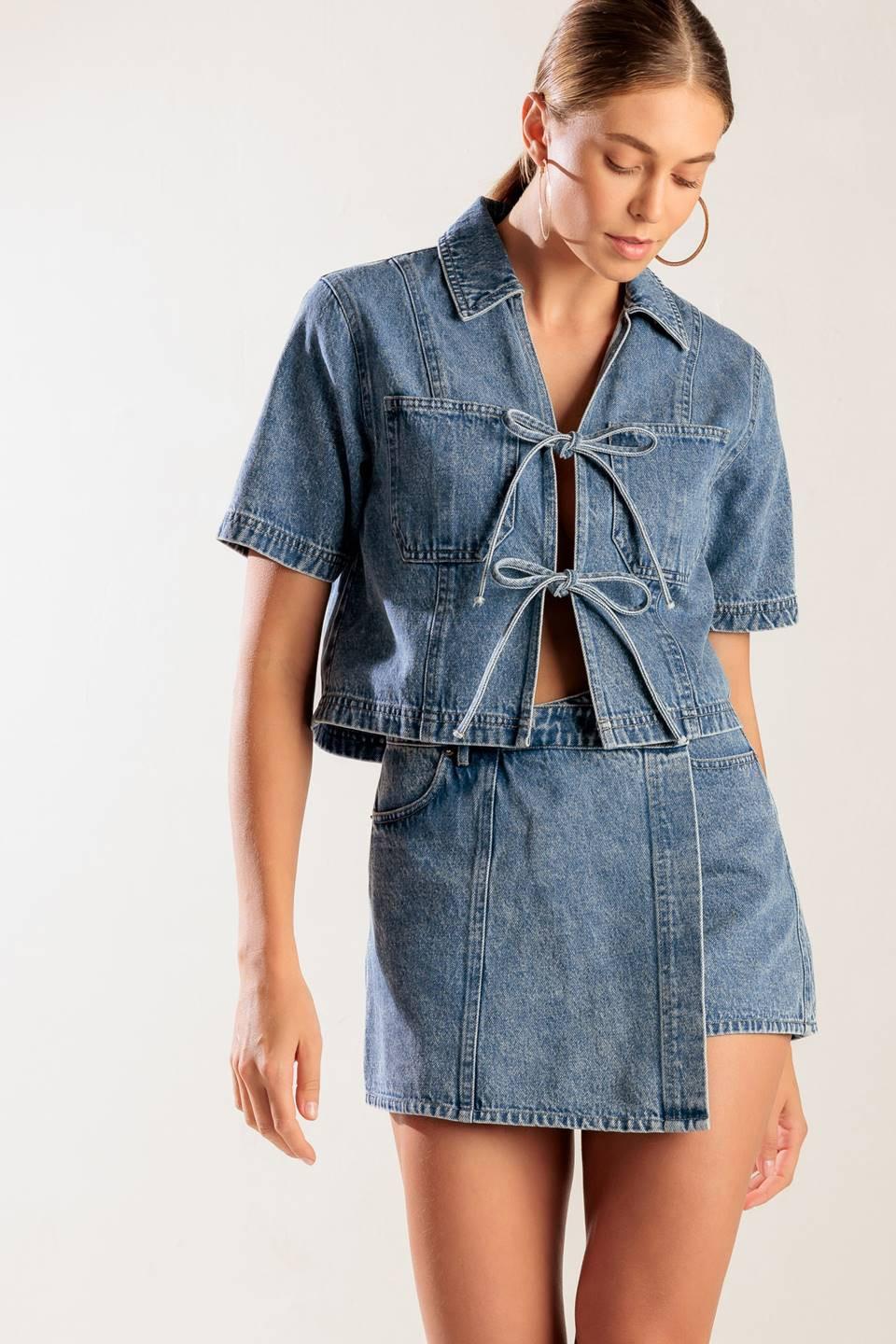 Flying Tomato By Chance Denim Skort, neatly folded to highlight its A-line silhouette and quality denim fabric.